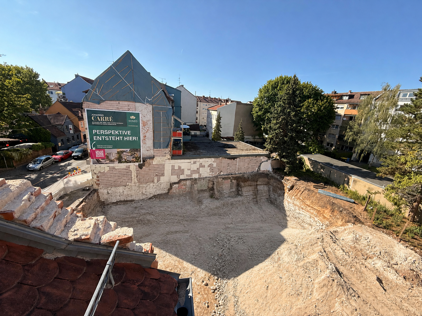 Baustelle Johannis Carré mit Bauschild „Perspektive entsteht hier“